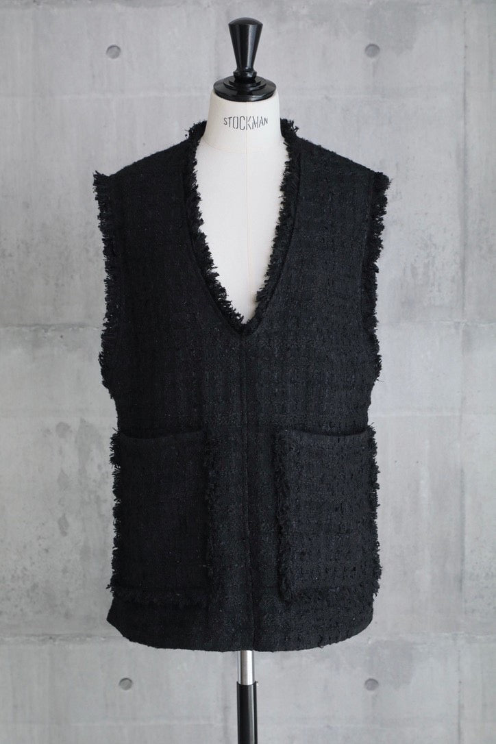 em. Tweed vest